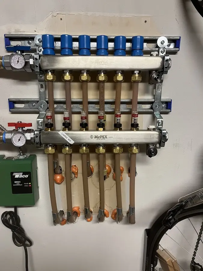 Plumber performing Water Heater Repair at a residential property in Greenfield